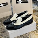 White and black leather corporate loafers
